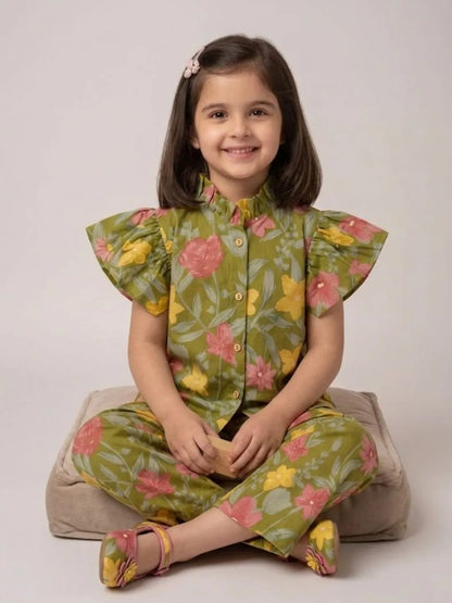 Girl sitting in green floral cotton co-ord set for casual wear and vacations