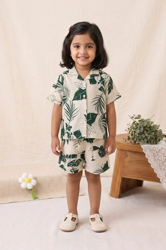 girl wearing leaf print co-ord set front view shirt and shorts outfit
