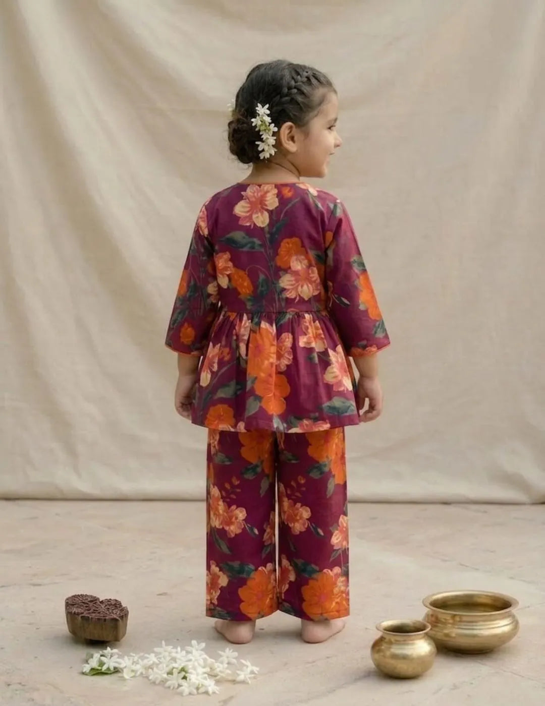 back view of girls maroon floral co-ord set top and pants