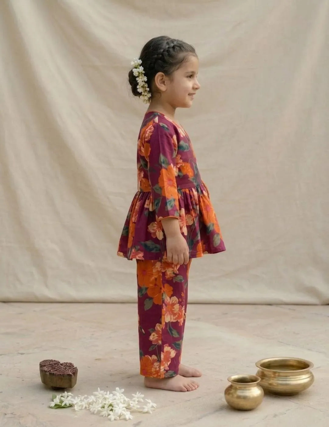 side view of girls maroon floral co-ord set wrap style outfit