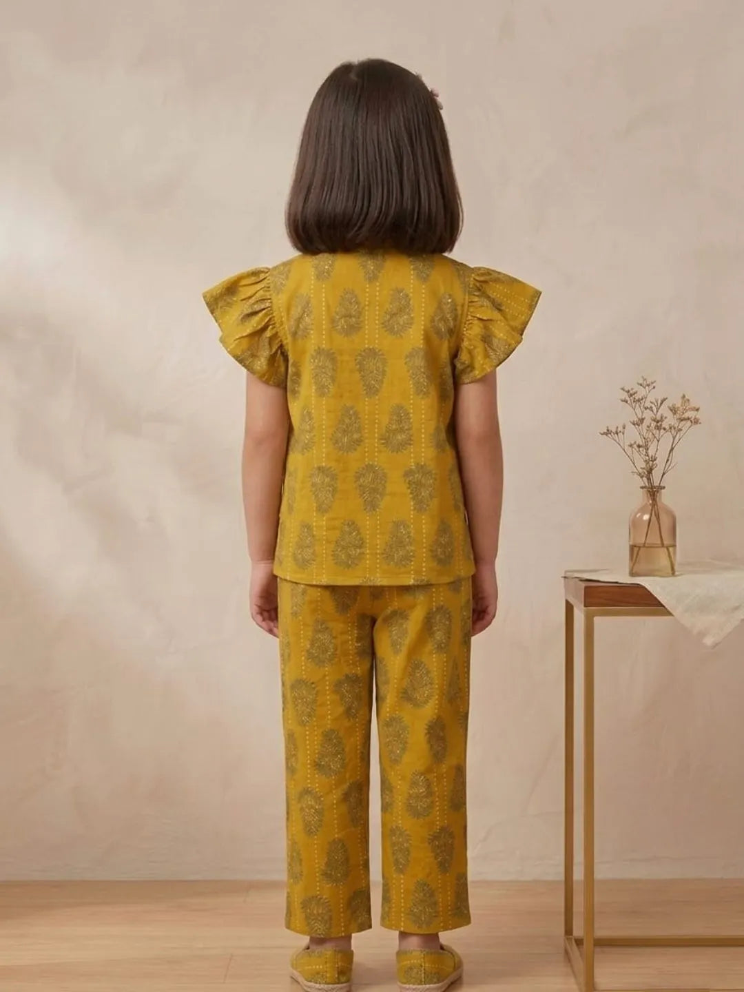 Back view of girls mustard printed cotton co-ord set with matching pants