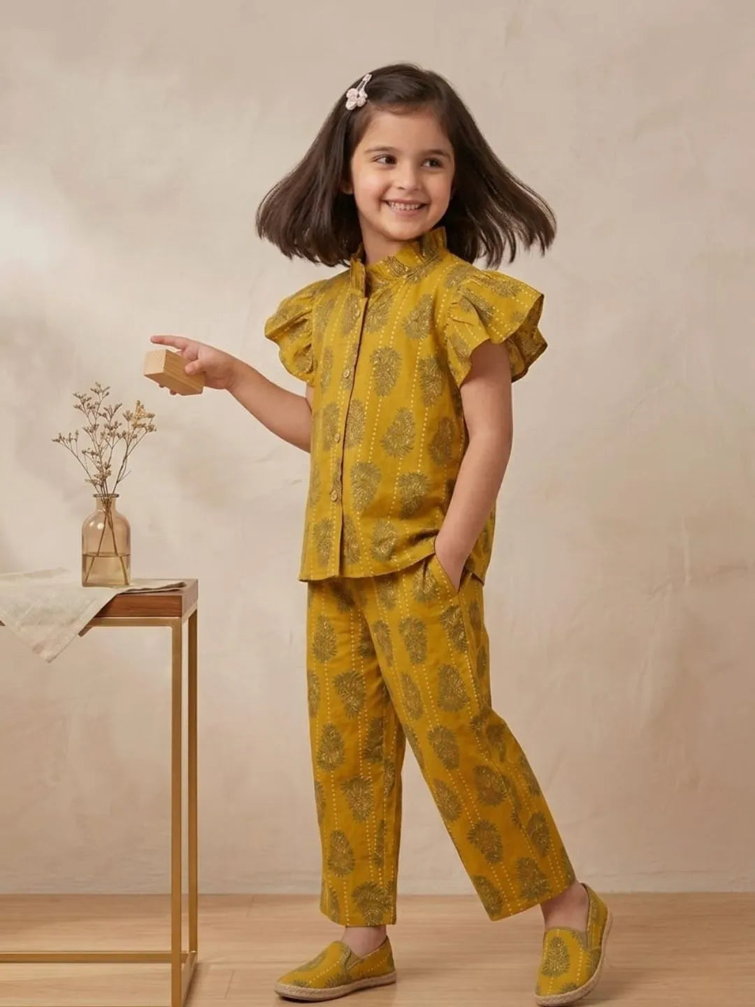 Side profile of girls mustard printed cotton co-ord set