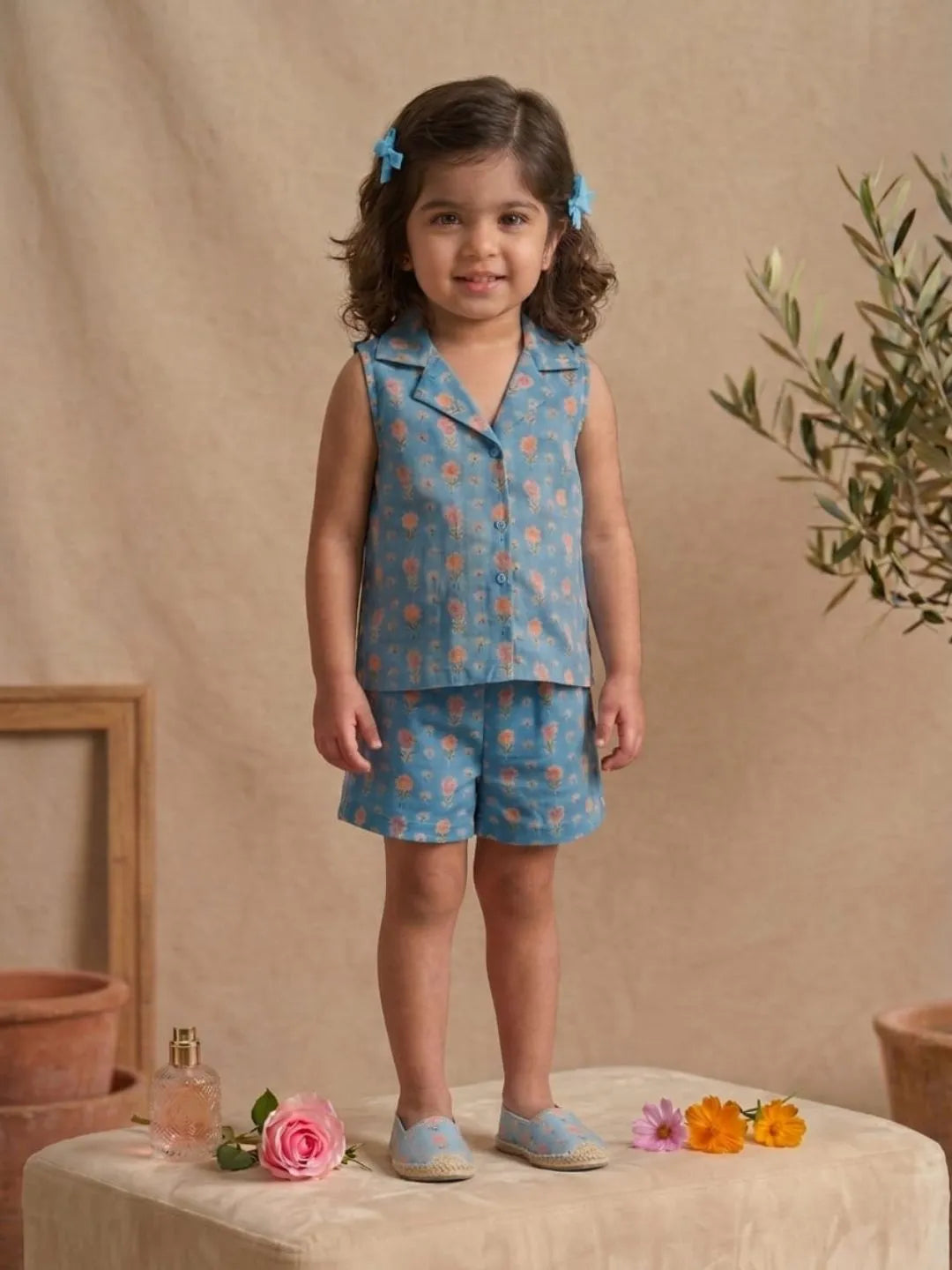 Girls pastel floral sleeveless co-ord set in blue front view