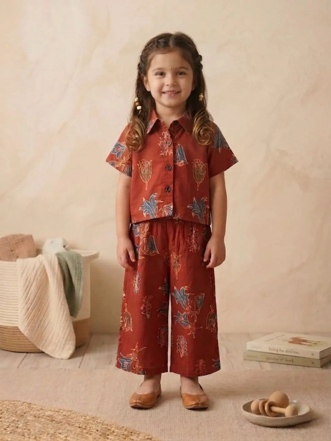 Girls rust printed co-ord set front view with shirt and wide-leg pants