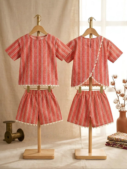 Girls striped cotton co-ord set front and back view, lightweight summer outfit with crochet lace detailing and comfortable elastic shorts