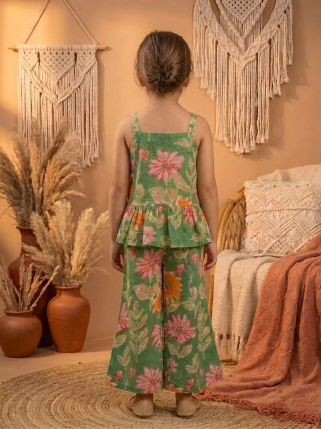 Back view of girls green floral co-ord set with sleeveless top and wide leg pants