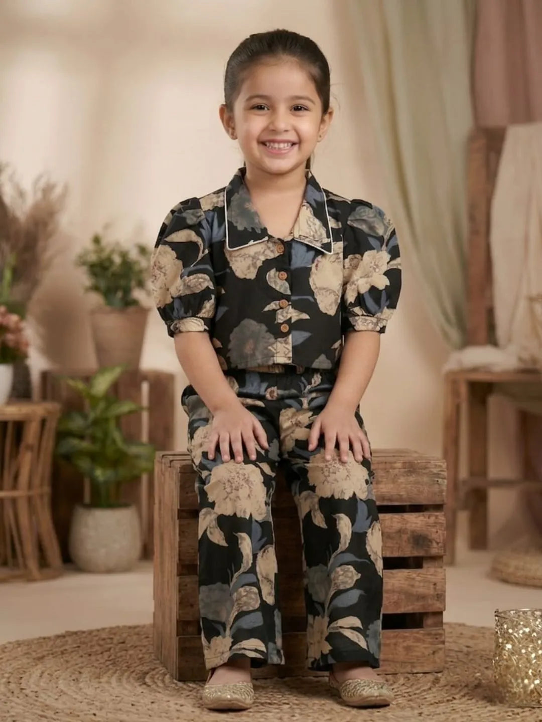 Kids black floral co-ord set front style with puff sleeves top and comfortable wide leg pants