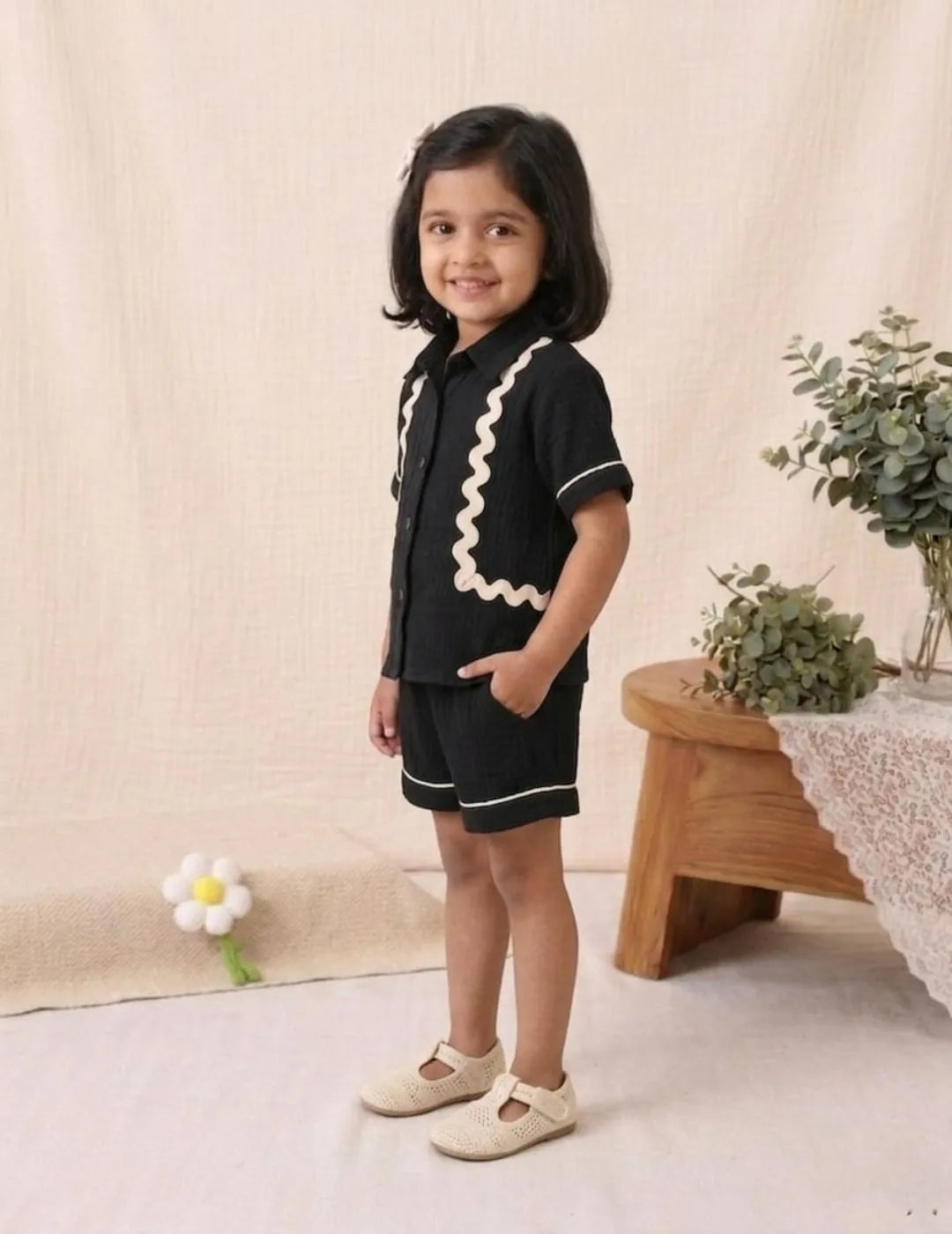 Side view of stylish black co-ord set in breathable cotton fabric