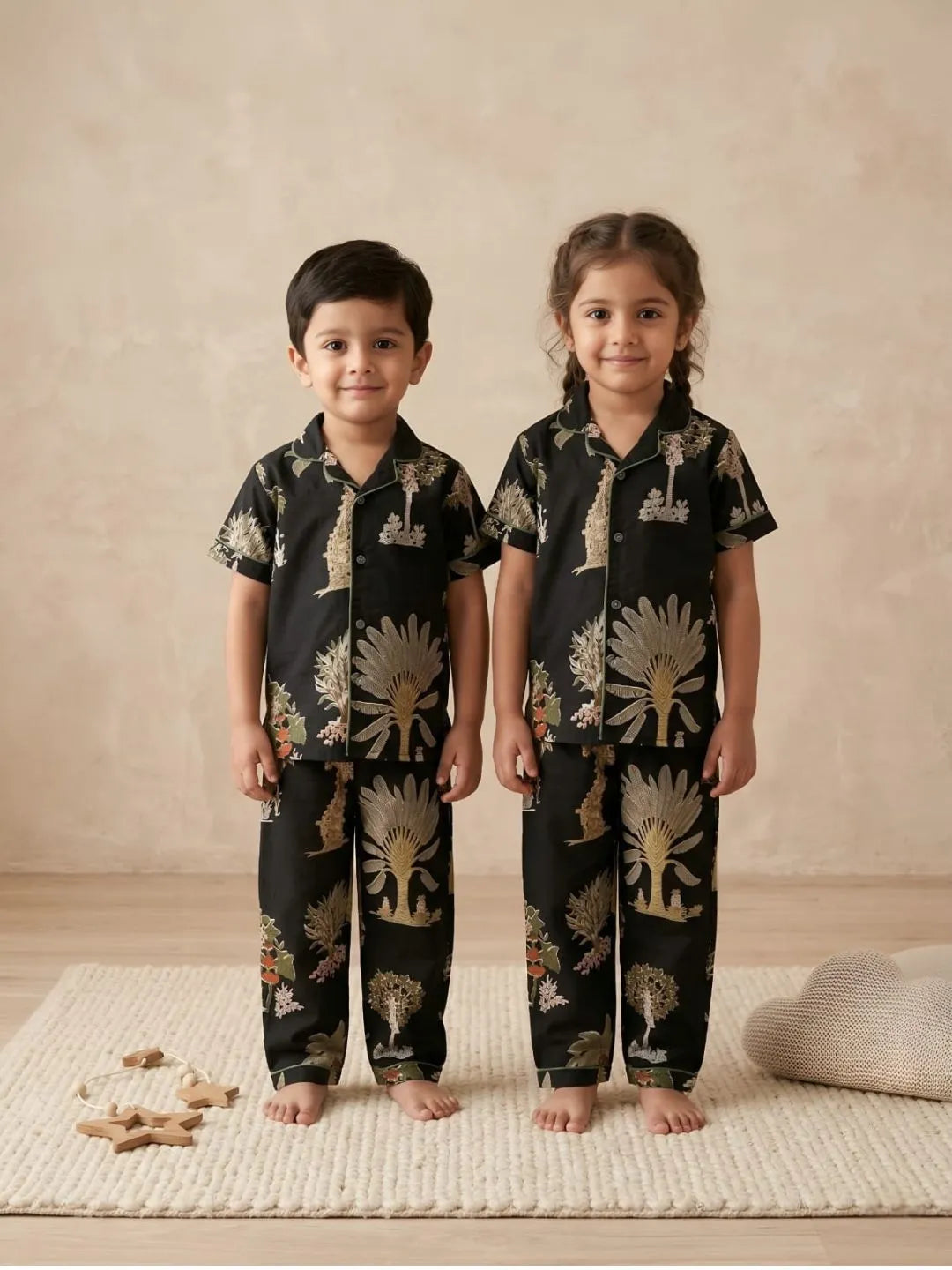 Kids black cotton nightsuit front view with printed shirt and pyjama set