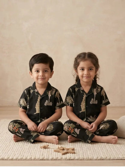 Kids black printed nightsuit sitting pose soft cotton sleepwear set
