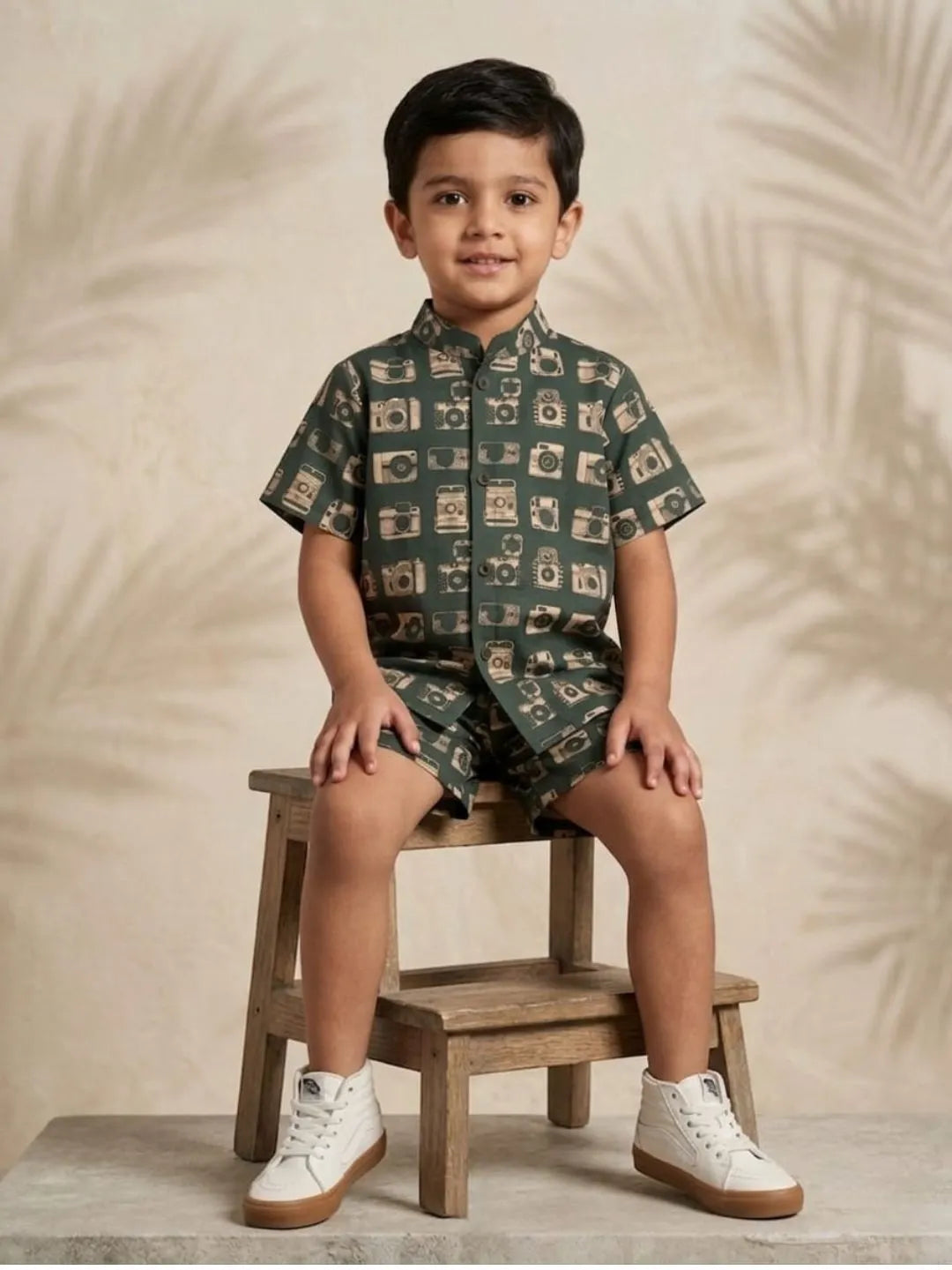 boys green camera print co-ord set sitting pose summer outfit kids cotton set