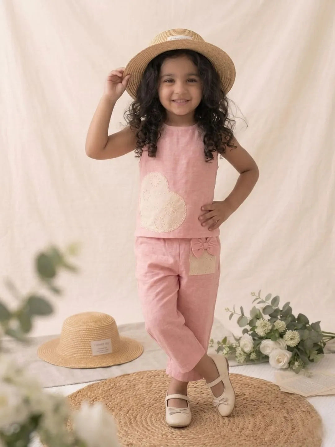 Stylish girls pink co-ord set heart lace detail front angle view