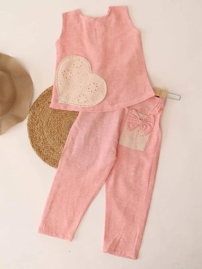 Trendy girls pink sleeveless top and pants co-ord set front view