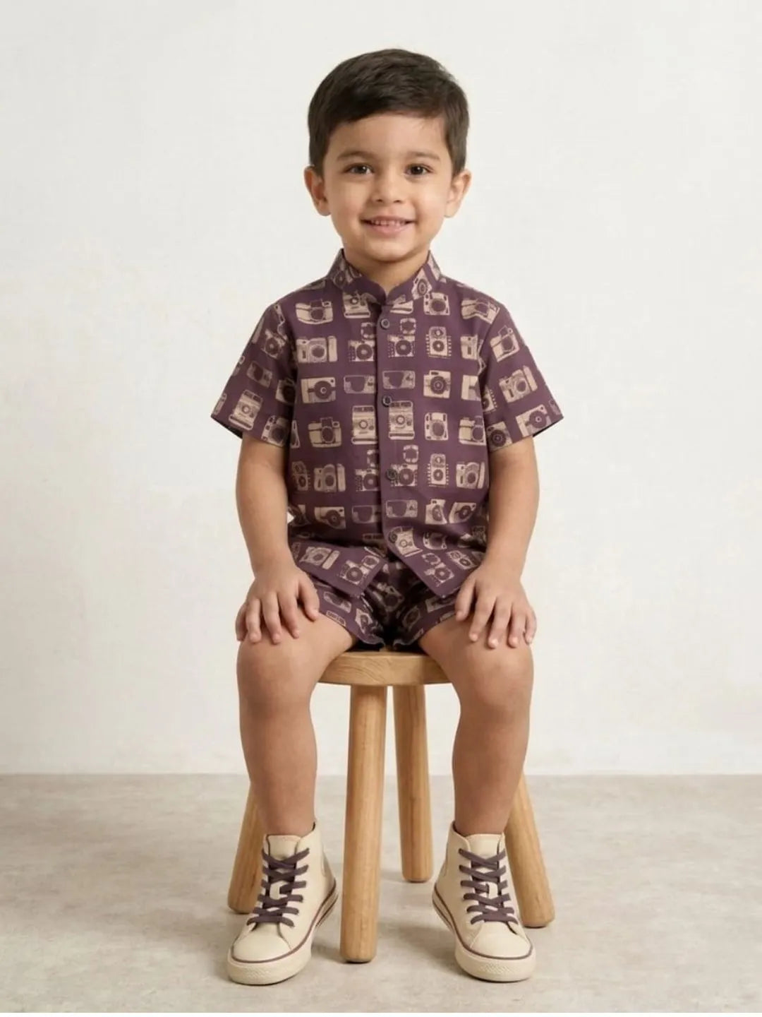 Boys purple camera print co-ord set sitting pose kids summer outfit