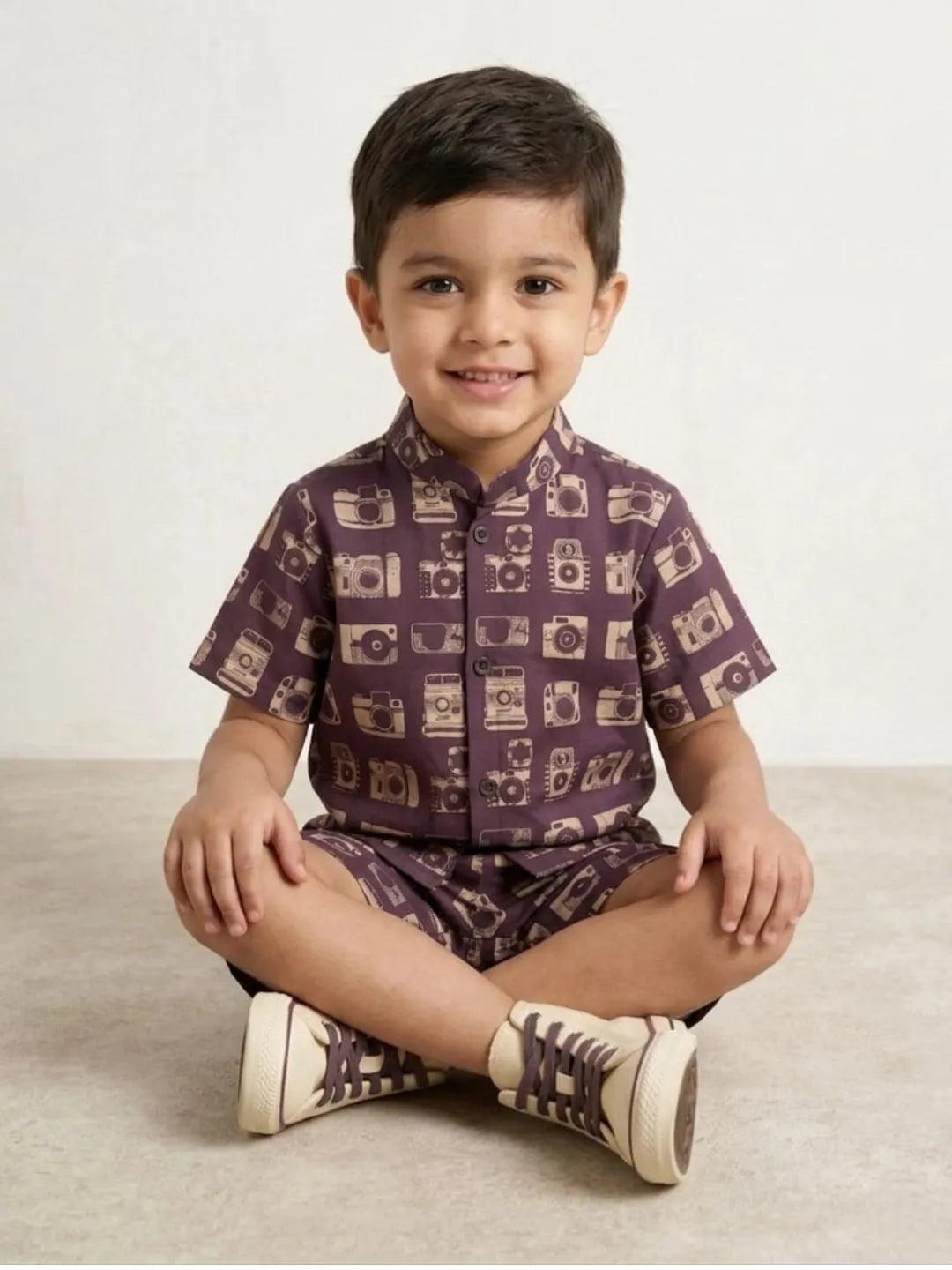 Boys purple camera print co-ord set sitting pose kids summer outfit