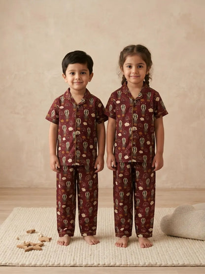 Kids red printed cotton nightsuit front view with shirt and pyjama