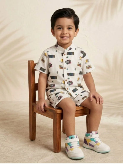Boys white retro print co-ord set sitting pose kids summer cotton outfit