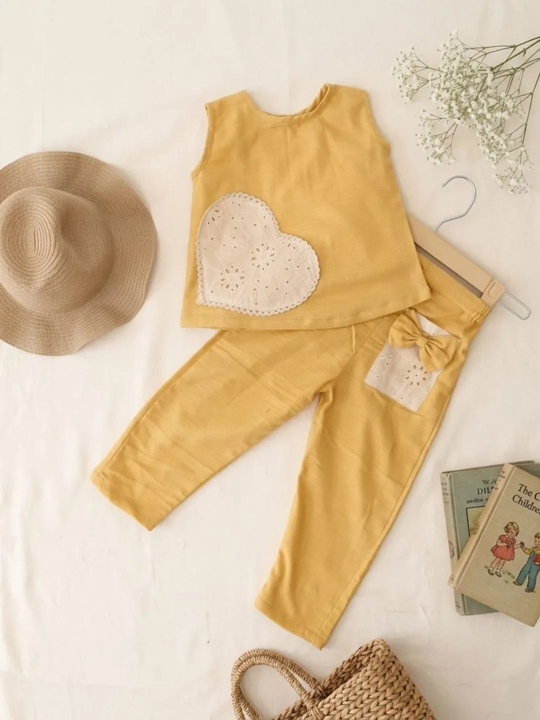 Trendy girls yellow sleeveless top and pants co-ord set front view