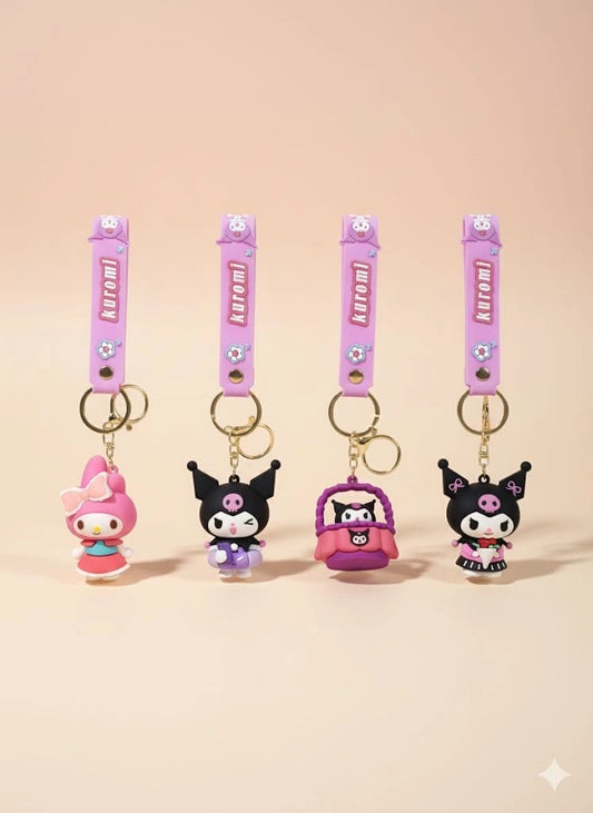 Set of four cartoon character keychains with pink straps on a beige background