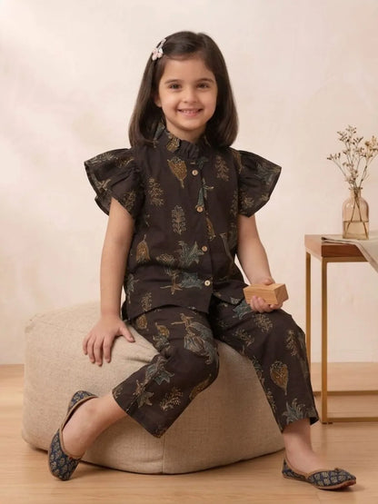 Girl Wearing Melody Chocolate Brown Floral Co-ord Set Sitting Pose