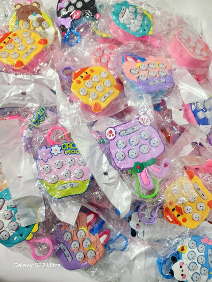 Assorted colorful children's toys with phone designs on a clear background