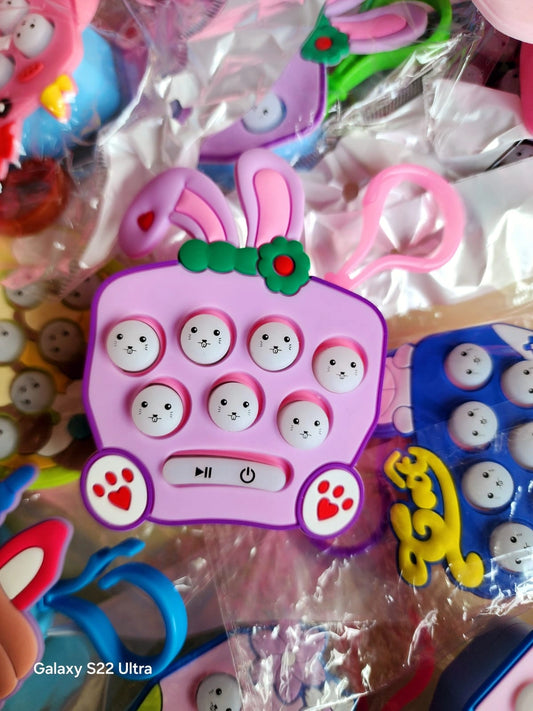 Colorful button toys with rabbit design in a clear plastic bag