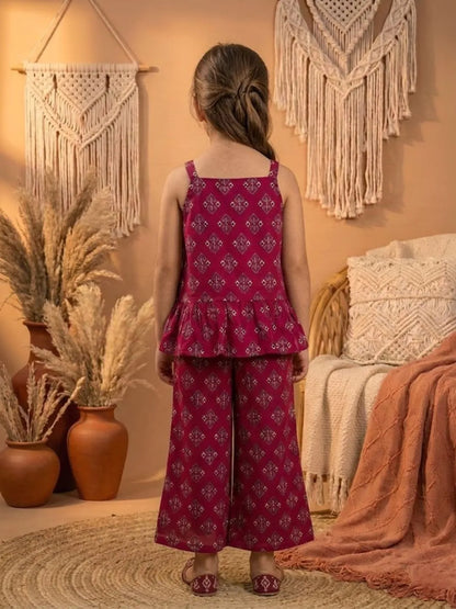 Back view of girls red printed co-ord set with sleeveless top and wide leg pants