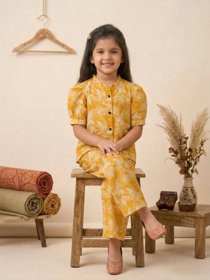 Kids yellow coord set sitting pose summer outfit